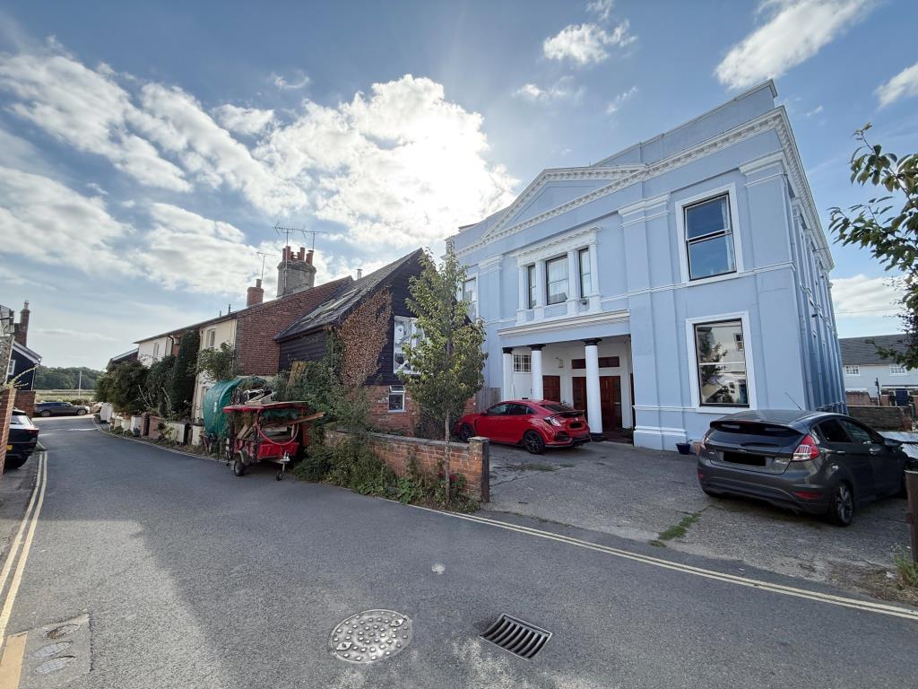 Lot: 5 - FORMER OFFICE AND BEDSITS WITH POTENTIAL CLOSE TO THE QUAY - View of the building the road leading to the Quayside